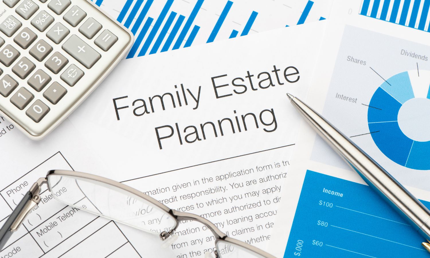 Family estate planning document with a calculator, glasses, and financial charts.