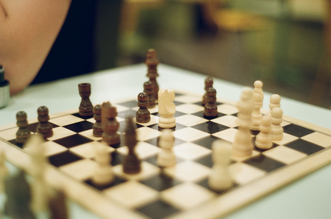 A close-up, dramatic shot of a modern chess board mid-game, symbolizing the silent, high-stakes strategic battle for global digital trust.